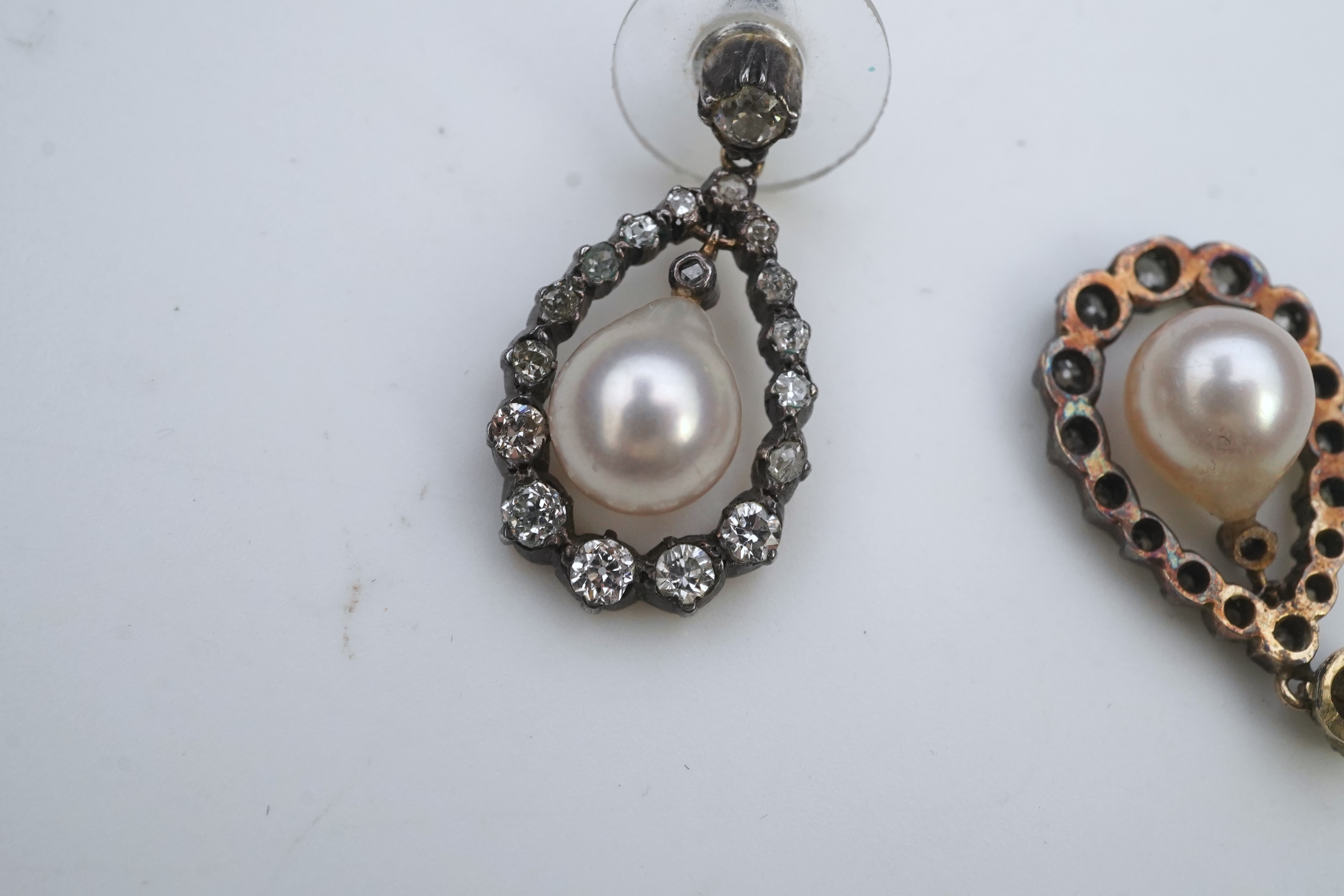 A pair of cultured pearl and diamond earrings